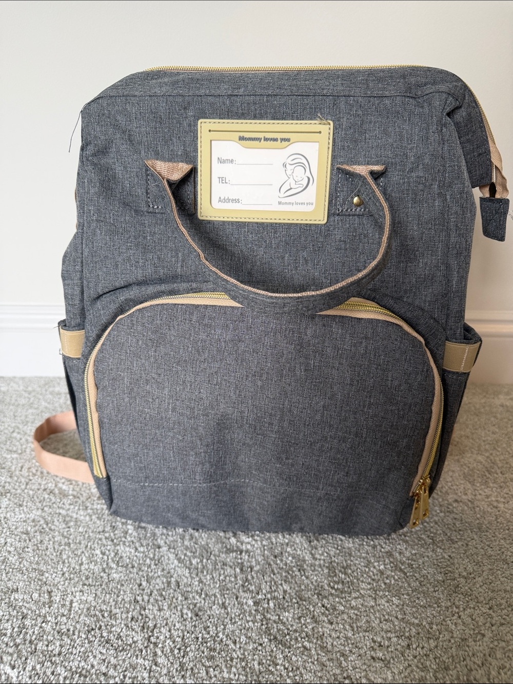 Diaper backpack with changing station